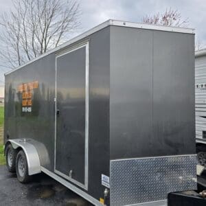 A trailer that is parked in the street.